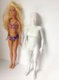 Regular Barbie stood next to the 3D printed "normal" Barbie Regular Barbie stood next to the 3D printed "normal" Barbie
