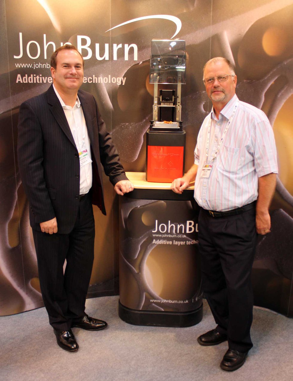 Brian Lang of John Burn and Peter Hansford of EnvisionTEC seal the deal