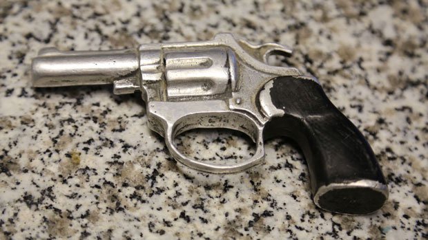 Metal gun cast from a toy water pistol Metal gun cast from a toy water pistol