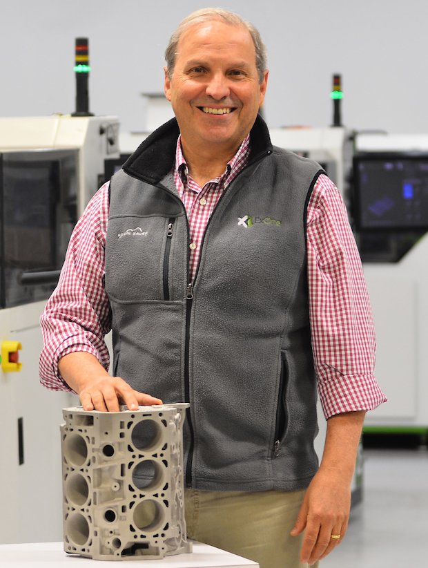 ExOne CEO John Hartner with engine block.jpg