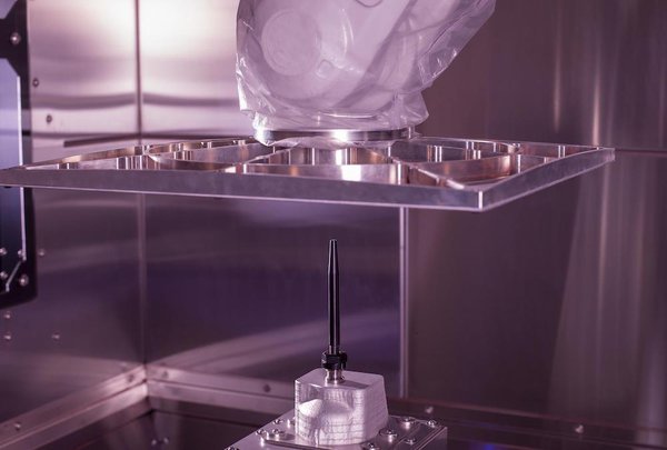 SPEE3D's rocket nozzle and six-axle robotic arm SPEE3D's rocket nozzle and six-axle robotic arm