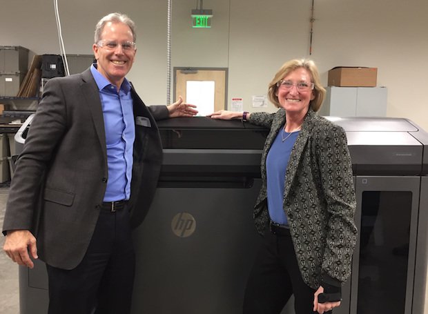 Proto Labs HP MJF      HP’s President of 3D Printing, Stephen Nigro, and Proto Labs President & CEO, Vicki Holt, visit a Multi Jet Fusion 3D printer at Proto Labs’ 77,000 square foot addit...