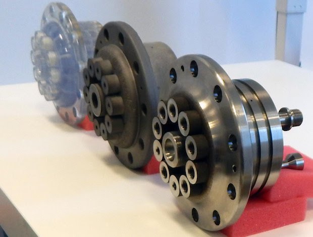 Lloyd's Register AM part oil and gas      From left to right, Safer Plug’s gateway manifold is show in three states of manufacture: Transparent stereolithographic prototype, additively man...