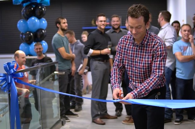 Creaform ribbon cutting new facility      Martin Lamontagne, Creaform’s founder and Business Unit Manager, cuts the ribbon to mark the official opening of the company's new headquarters. -...