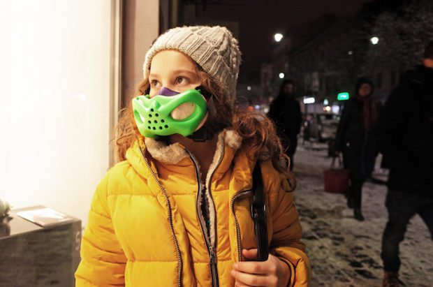 Children's pollution mask      Bartlomiej Gaczorek's 3D printed protective mask, being modelled by a child after finishing and colouring.