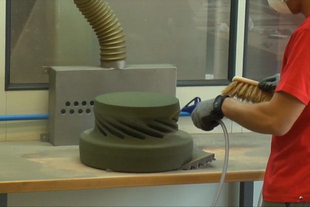 Voxeljet sand casting      A Voxeljet 3D printed sand mould being prepared for casting. - Voxeljet/ YouTube