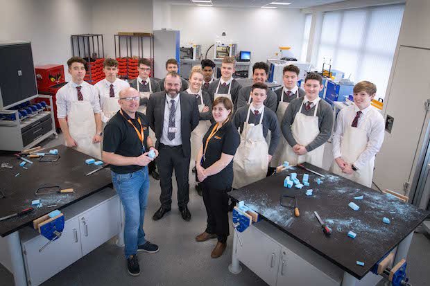 Renishaw FDC      Simon Briggs and Sarah Lewis stand inside the Fabrication Development Centre with one of many groups of pupils to use the facility. - Renishaw
