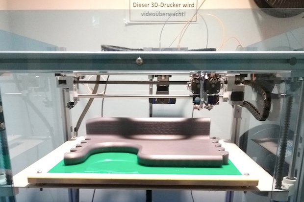 German RepRap x400 with manufactured puzzle part      A puzzle part being manufactured on the German RepRap x400.