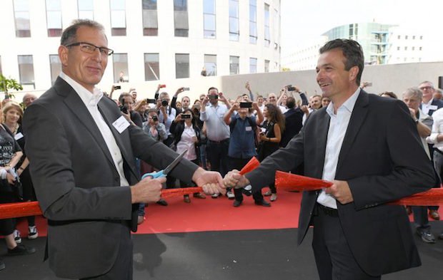 XJet AMC      Hanan Gothait, CEO of XJet, cuts the ribbon with Stephan Oehler, VP of Straumann, marking the official opening of the Additive Manufacturing Center.
