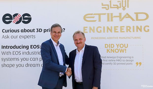 EOS Etihad      Markus Glasser of EOS, left, shakes hands with Bernhard Randerath of Etihad Airways. - EOS