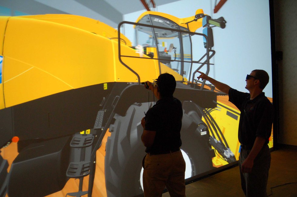Virtalis VR      Immersed users at CNH explore and interact with the giant VR model.
