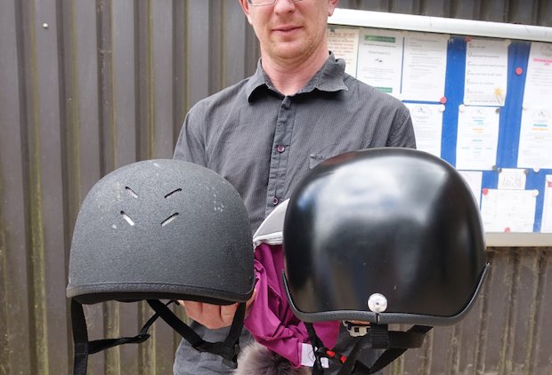 Artec horse riding helmet      Ross Head holding a commercially available helmet (left) and a Cerebra custom helmet (right).