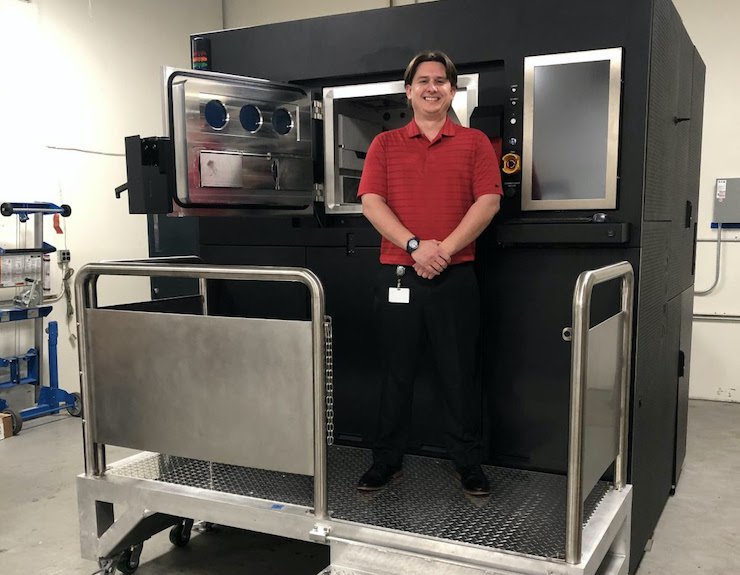 CHromalloy VELO3D MRO      Zack Hopkins, Engineer II, Chromalloy Gas Turbine, with the company’s newly delivered Sapphire metal additive manufacturing system.