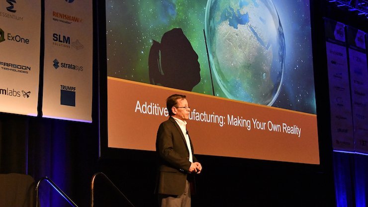 Todd Grimm on stage at AMUG 2019.