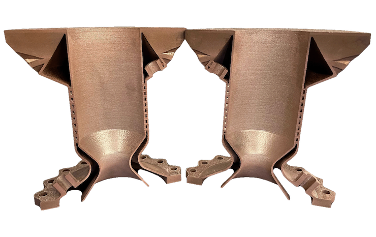A cross-sectioned thrust chamber printed on a Velo3D Sapphire system in GRCop-42. The chamber walls contain internal channels for regenerative cooling. - Velo3D