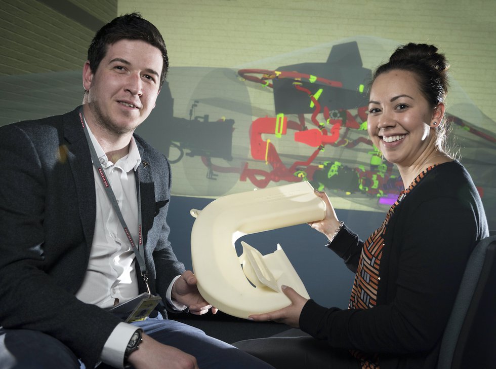 BAE Head of AM Jenny Manning with a 3D printed cooling duct. - BAE Systems