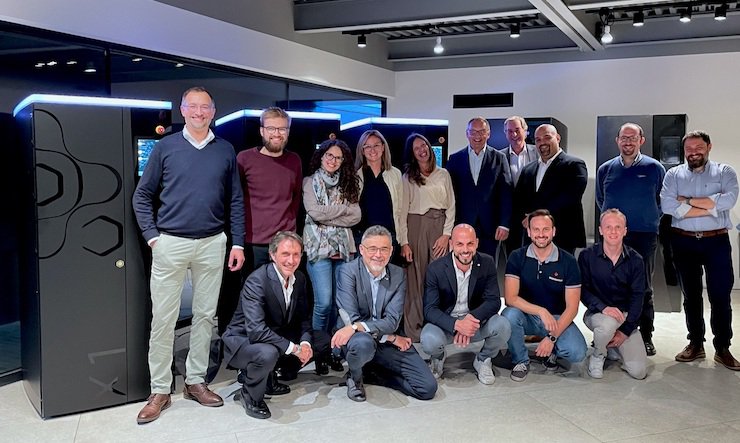 After signing the contract for the investment round: The management and team members of the HZG Group and Axtra3D in front of the first three Lumia X1 3D printers - Axtra3D