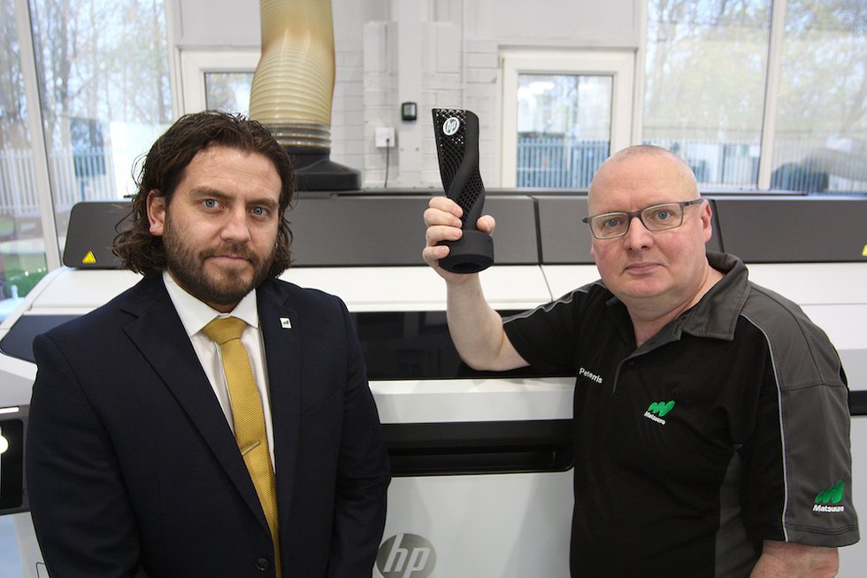 Joseph Bellis and Peter Harris with HP Award for most systems sold in 2022.