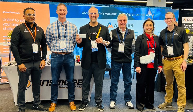 HP and ADDMAN leadership celebrate the machine installation and beta-period success at AMUG 2023. - ADDMAN/Dinsmore