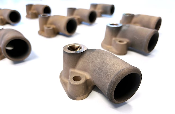 The 3D-printed bronze manifolds. - MAN Truck & Bus/ Replique