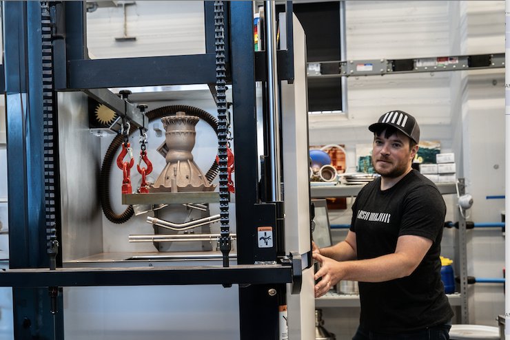 Ursa Major's Thomas Pomorski prepares one of its Hadley engine chambers for transport after 3D printing is complete at its Youngstown OH manufacturing facility. Ursa Major announced today ...