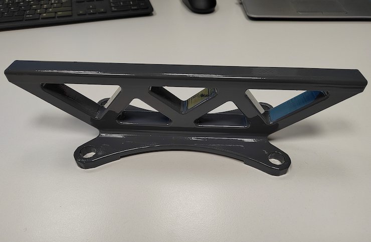 An antenna holder that encapsulates the antenna wire. The 3D printing process is paused to insert the antenna wire and then restarted to ensure the antenna is fully protected by the 3D pri...