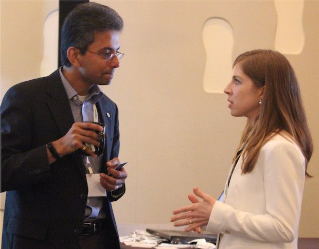 Elysium draws large engineering firms to global summit on CAD software      Annalise Suzuki (right), Director of Technology and Engagement for Elysium, speaking with presenter Ram Pentakot...