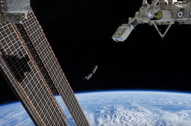Deployment of CubeSat in space (NASA).png