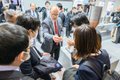 Exhibitors meet with customers on the TCT Japan show floor