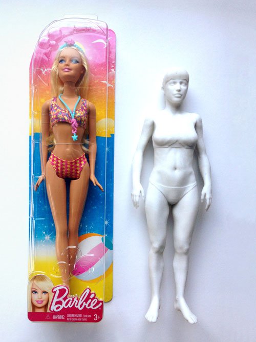 3D printed Barbie next to a pre-packed Barbie